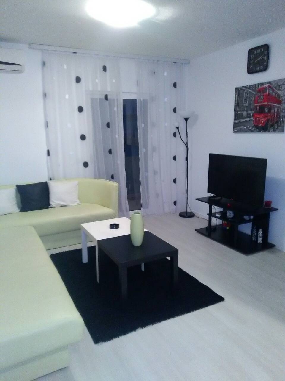 Bright living room in a house in Shushan, Montenegro: corner sofa, coffee tables, TV area, and modern interior.