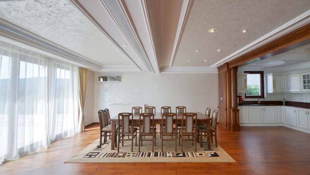 Spacious living room with dining area and classic kitchen in a villa in Herceg Novi, Montenegro.