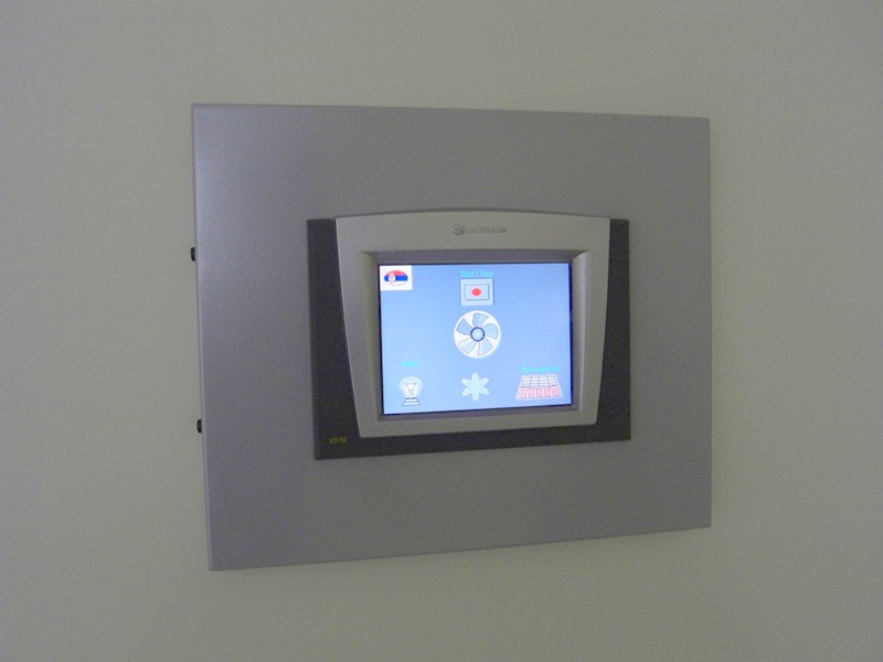 Touchscreen control panel for the smart home system in a modern apartment in Budva, Montenegro.