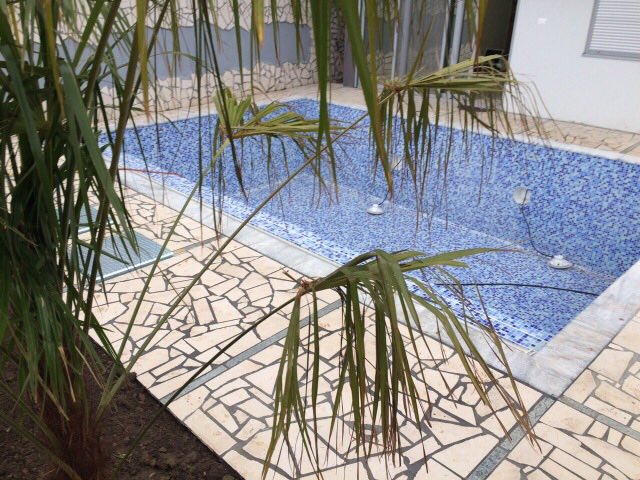Private pool with mosaic finish and a natural stone terrace by the house in Shushan, Montenegro.