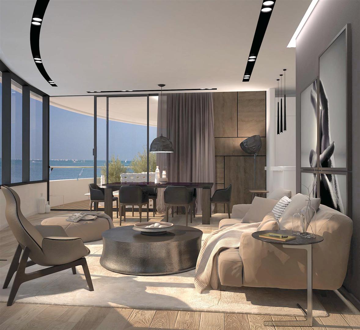 Modern living room in an apartment in Budva, Montenegro: panoramic sea view, designer furniture, and stylish interior.