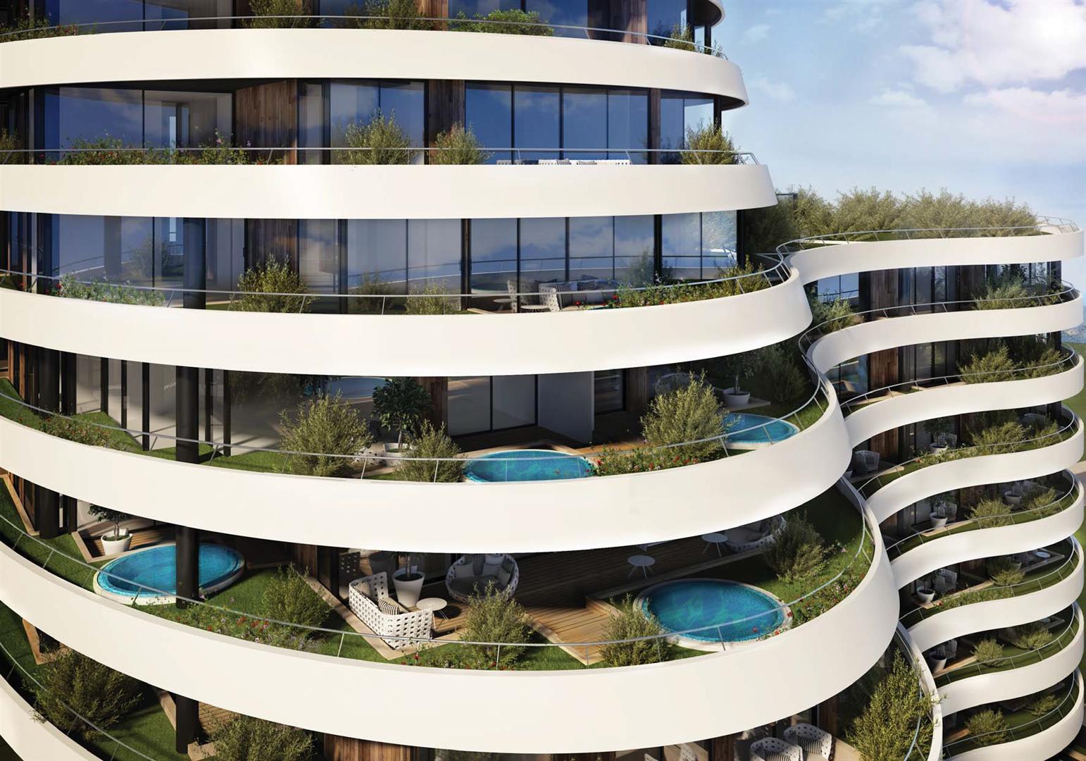 Modern residential complex in Budva, Montenegro: terraces with private pools, landscaping, and a relaxation area.