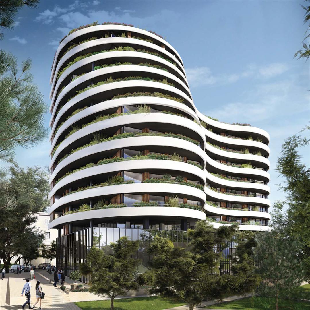 Modern residential complex with curved terraces and landscaping in Budva, Montenegro — luxury property exterior.