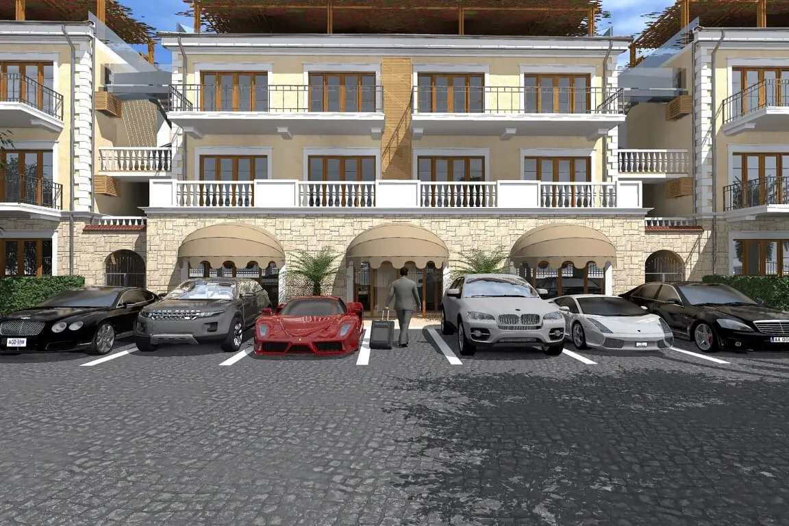 Exterior view of a multi-story building facade with a parking area in front featuring luxury cars.