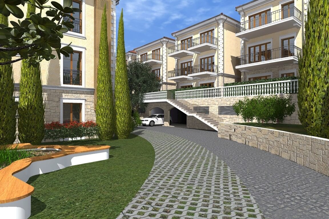 View of a modern residential complex in Risan, Montenegro: stone facade finishes, landscaped grounds, and parking.