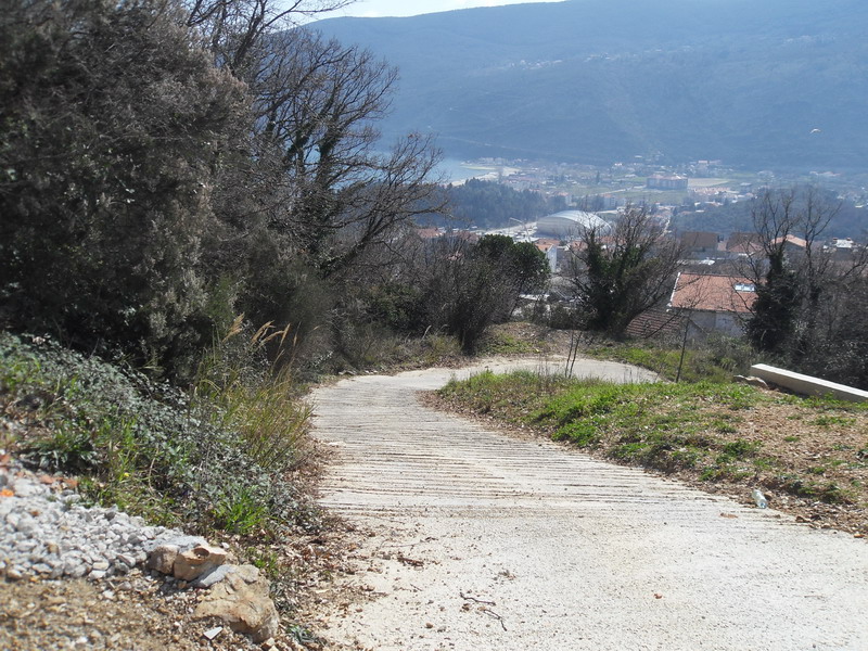 Concrete driveway to a land plot in Herceg Novi, Montenegro, with panoramic views of the bay.