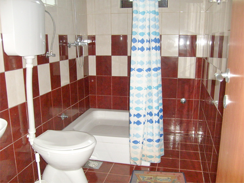 Bathroom with shower cabin and tiled walls in Villa No. 446 in Prčanj, Montenegro: bathroom interior with sanitary fixtures.