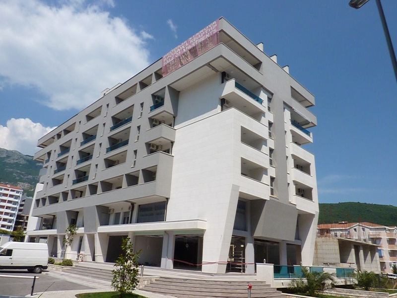 Modern apartment building with balconies in Budva, Montenegro: sale of new apartments from the developer.