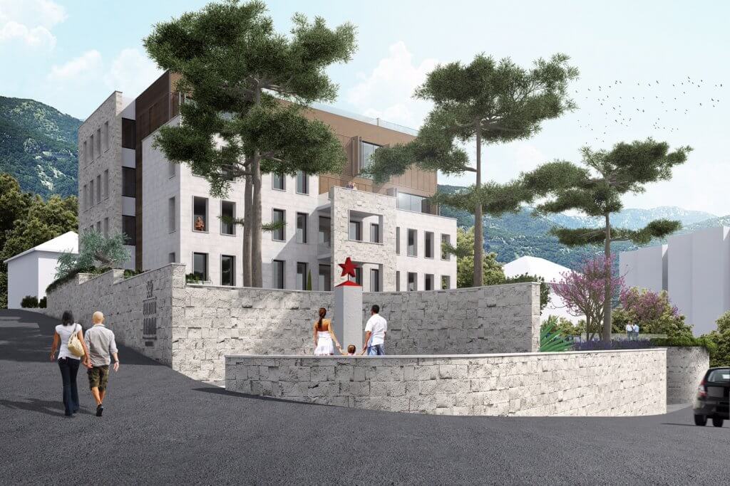 Modern residential complex in Tivat, Montenegro: stone facade, panoramic windows, and landscaped grounds.