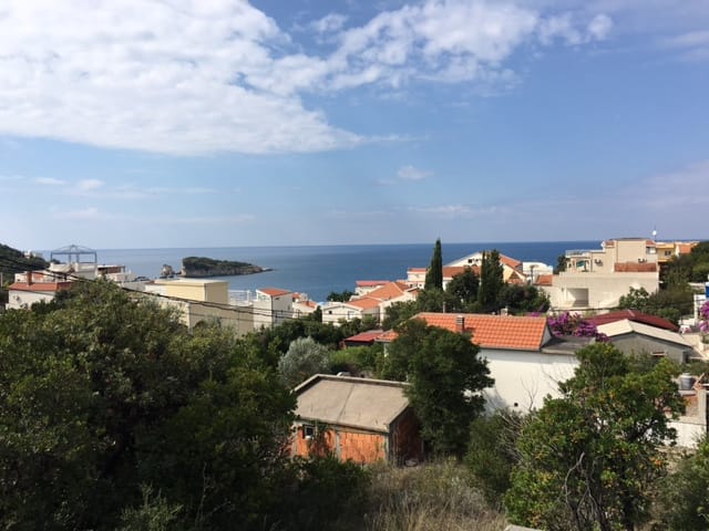 Panoramic view of the sea and the village of Utjeha, Montenegro: a plot of land with greenery and a sea view.