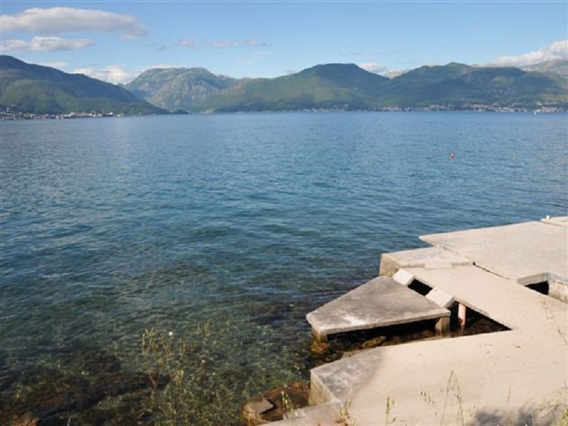 Sea and mountain view from a private concrete pier on a plot of land in Krašići, Montenegro.