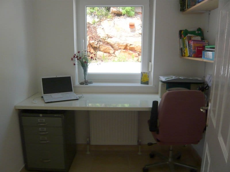 Study with a desk and a view of the rocks in a house in Nikšić, Montenegro.