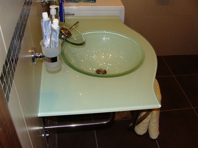 Glass sink in a modern apartment bathroom in Budva, Montenegro: stylish finishes and plumbing fixtures.