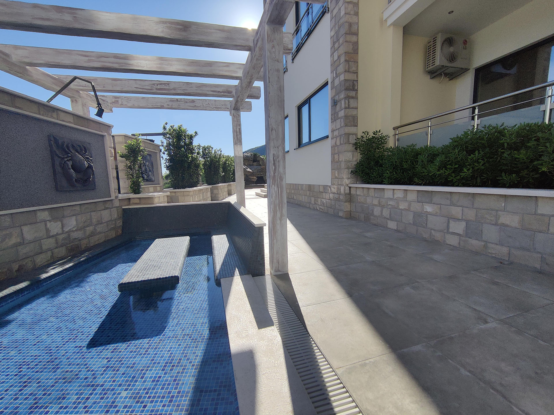 Pool with mosaic finish and terrace with pergola in the MonteDreams residential complex, Becici, Budva Riviera, Montenegro