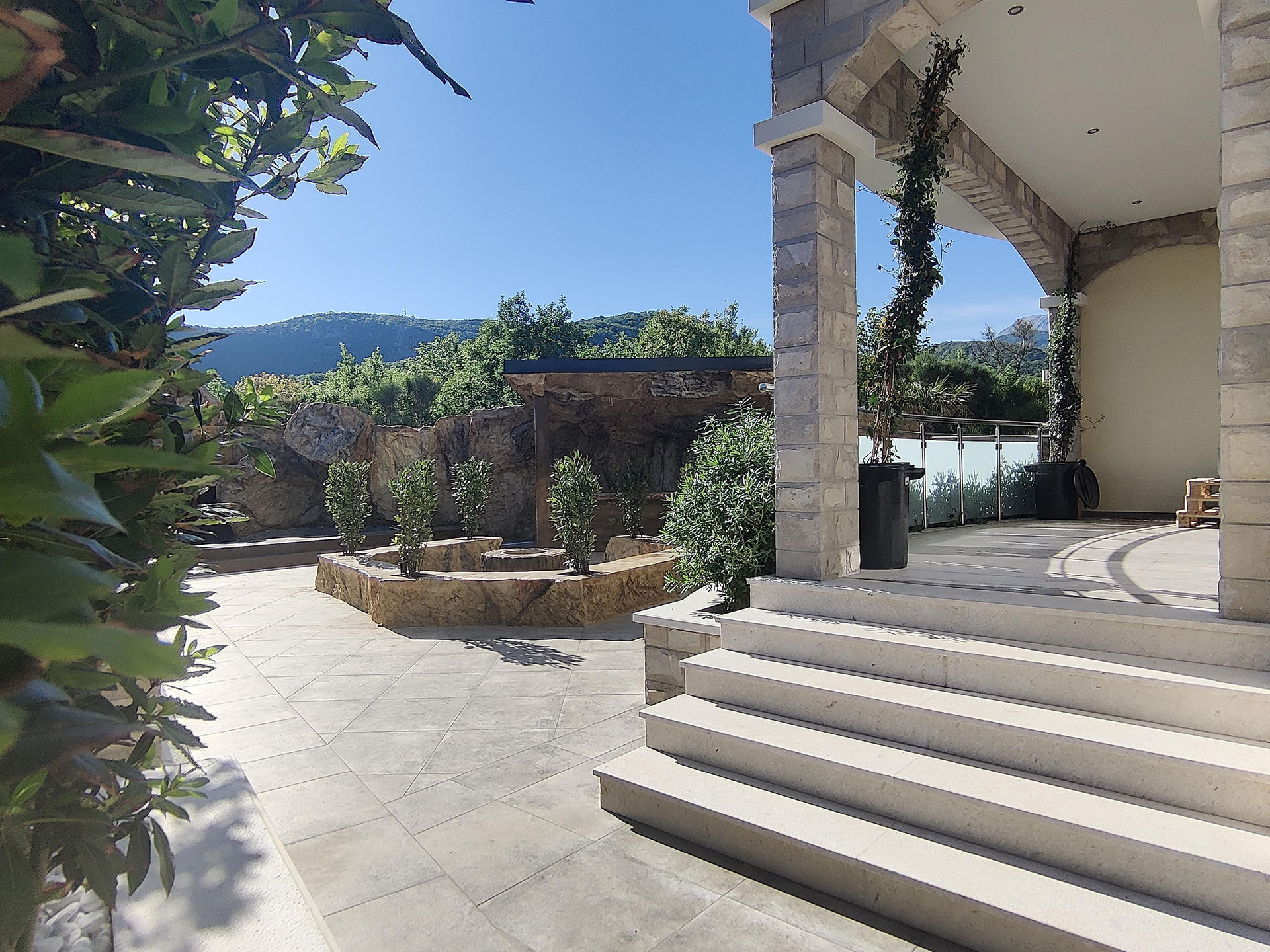 Terrace with stone finish and lounge area in MonteDreams, Becici, Budva Riviera, Montenegro.
