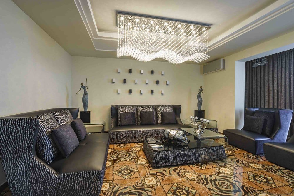Luxurious living room with designer furniture and a crystal chandelier in a villa in Seoce, Montenegro.
