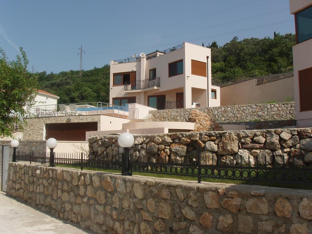 Modern villa with a pool and stone finish in Šušanj, Bar Riviera, Montenegro. Exterior view of the house.