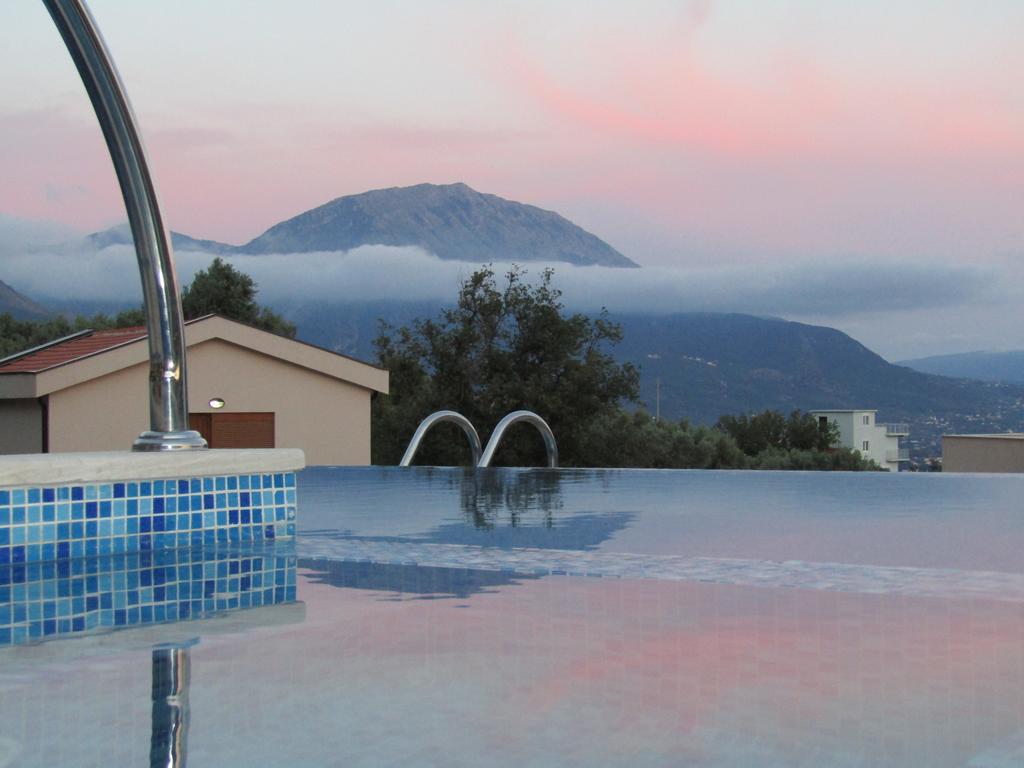 Infinity pool with mountain and sunset views at a house in Šušanj, Bar Riviera, Montenegro.