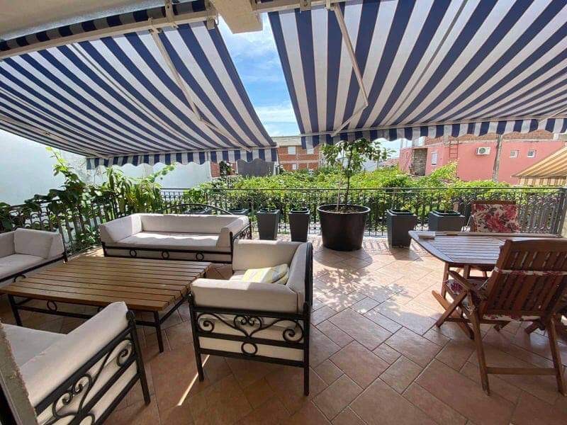 Cozy terrace with an awning and garden furniture in a house, Shushan, Montenegro: view of greenery and the relaxation area.