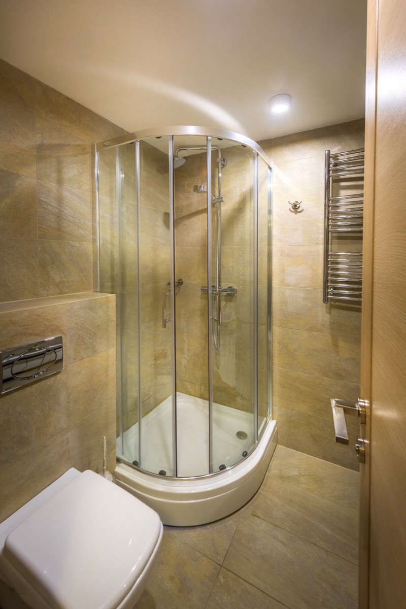 Bathroom with a walk-in shower and beige tiles in a villa in Krašići, Montenegro. Modern sanitary ware.