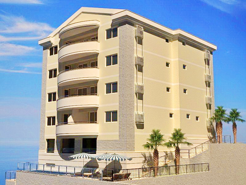 Modern hotel in Bečići, Montenegro: view of the building with a terrace, pool, and palm trees on the Adriatic coast.
