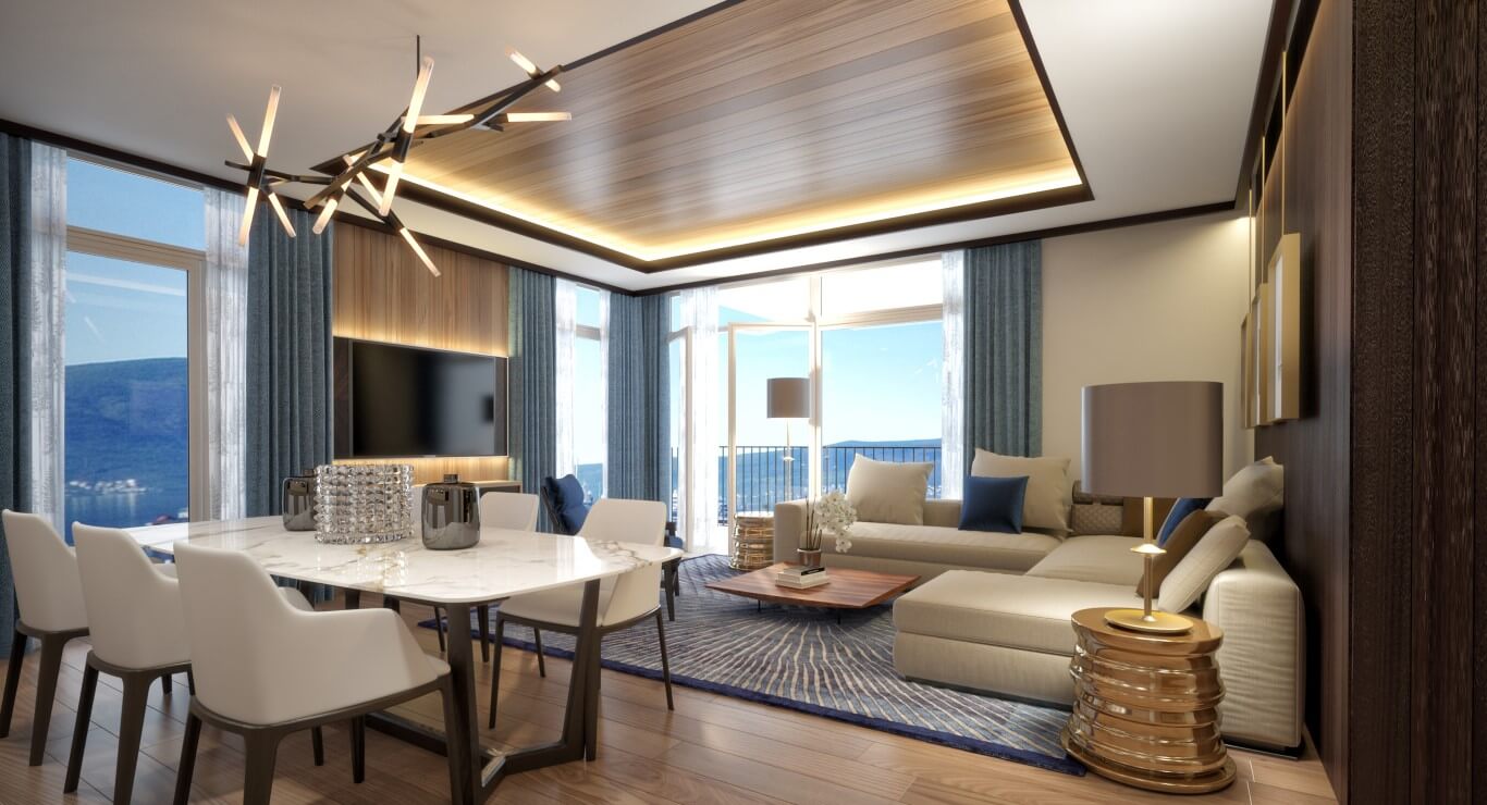 Modern living room with panoramic sea view in an exclusive apartment, Tivat, Montenegro: marble table and upholstered furniture.