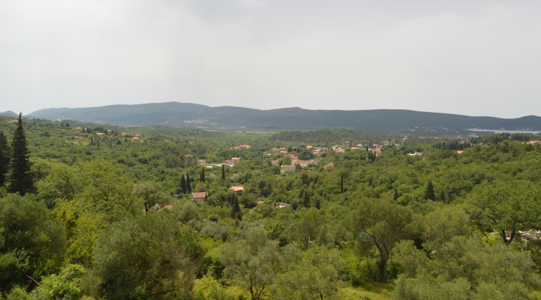 Panoramic view of green hills and the valley in Tivat, Montenegro, from the grounds of Villa No. 153 surrounded by forests.