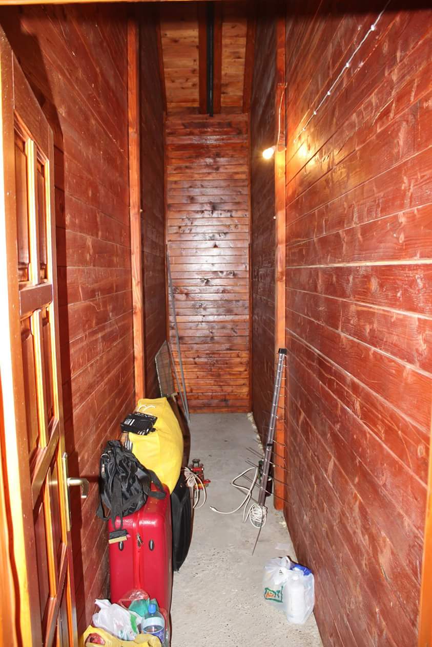 A narrow corridor with natural wood finishes in a house for sale, Sutomore, Montenegro.