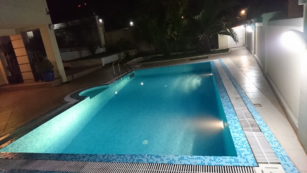 Private pool with night lighting on the villa grounds in Utjeha, Montenegro.