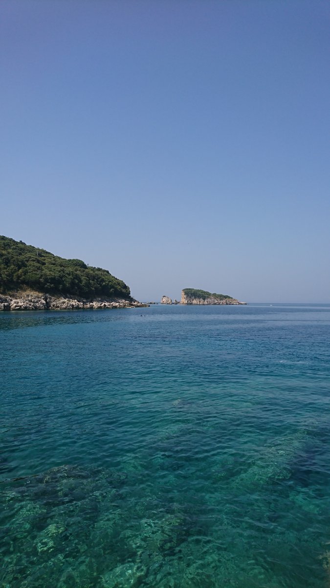 View of the Adriatic Sea and rocky islands off the coast of a villa in Utjeha, Montenegro. Panorama of the seashore.