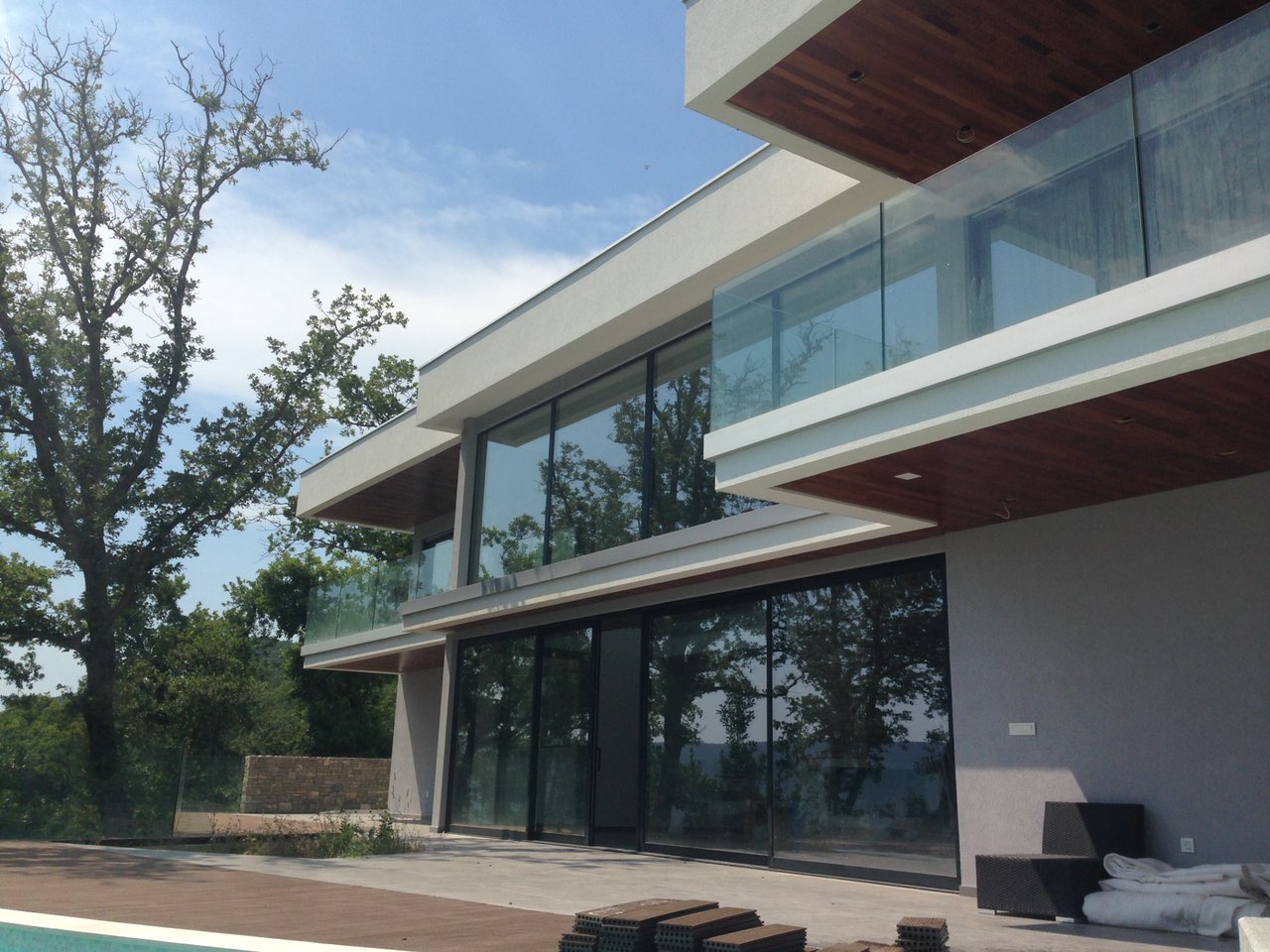 Modern villa with panoramic windows and a terrace in Herceg Novi, Montenegro: view of the facade and pool.