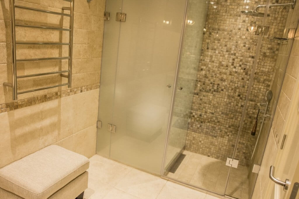 Modern bathroom with a shower cabin and tiled finishes in a villa, Stoliv, Montenegro.