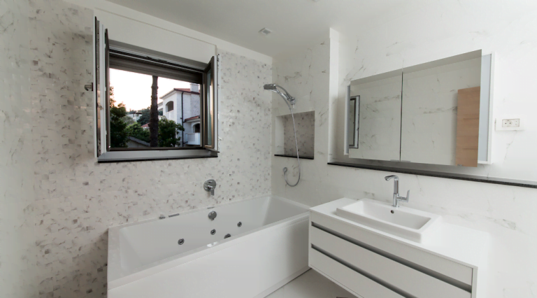 Modern bathroom with a jacuzzi and marble finishes in a villa in Herceg Novi, Montenegro.