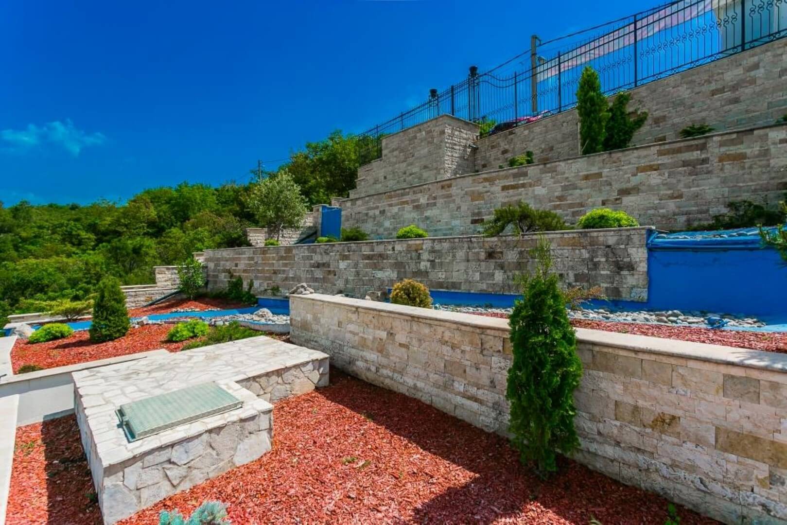 Terraced plot with stone retaining walls and landscape design by a villa in Krašići, Montenegro.