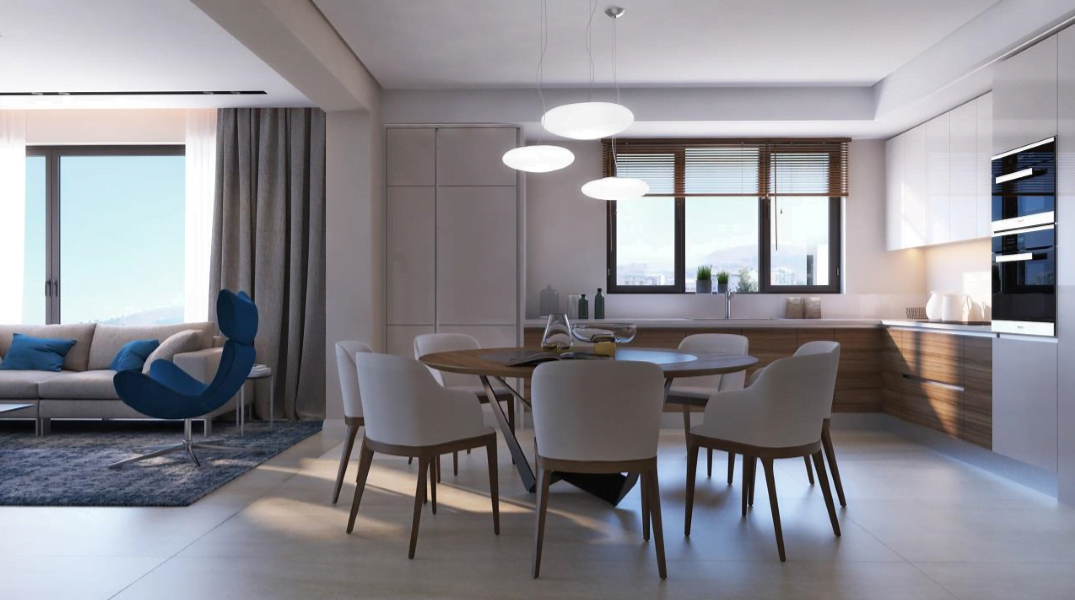 Modern kitchen-living room with dining area in a residential complex in Bečići, Montenegro: bright interior, built-in appliances, and furniture.