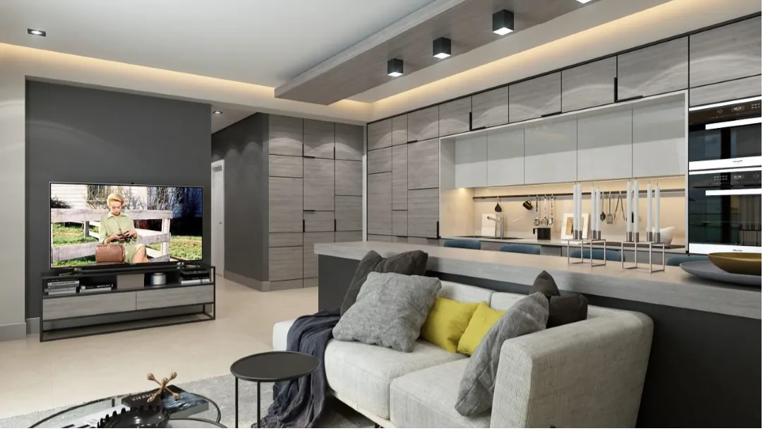 Modern living room featuring a sofa, TV, and an open kitchen area in the background.