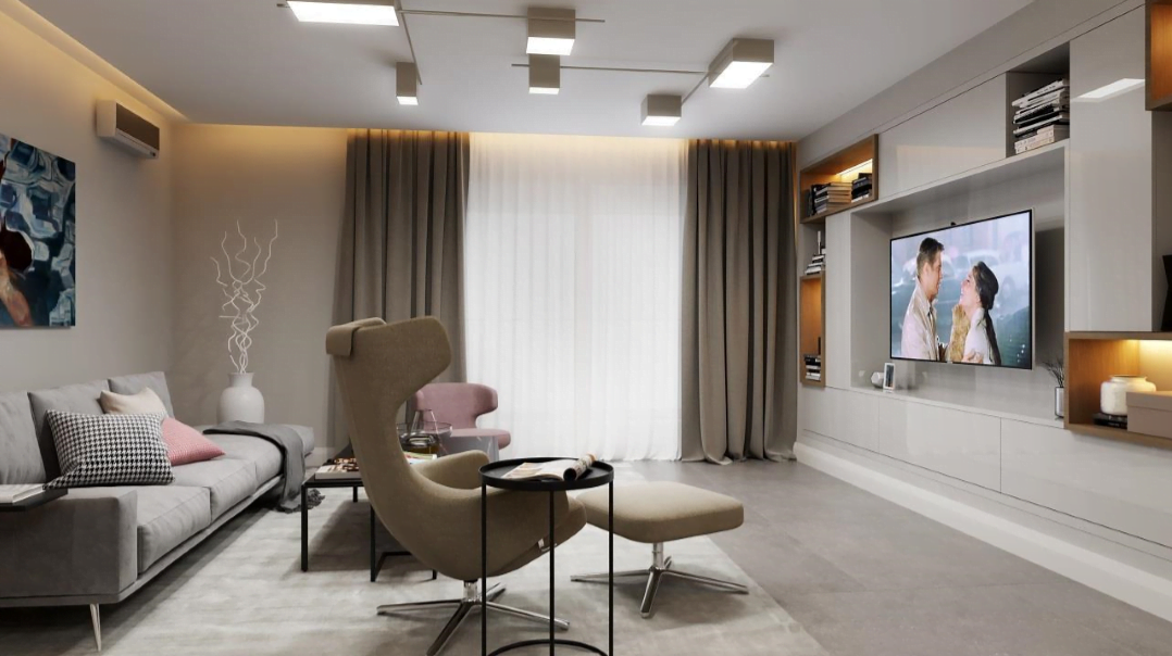 Modern living room in the Rafailovići residential complex, Bečići, Montenegro: stylish furniture, TV area, and a cozy interior in gray tones.