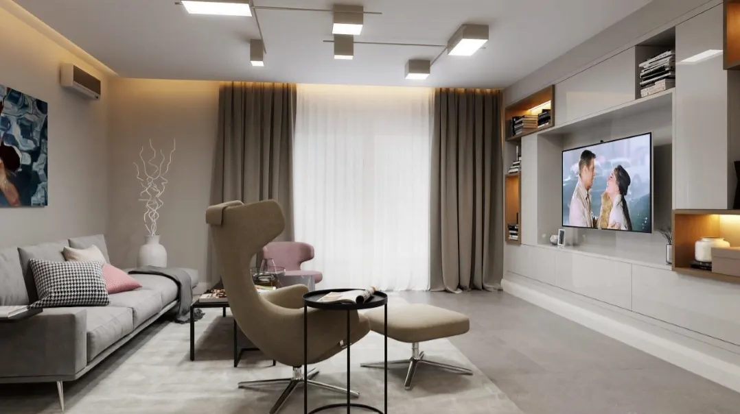 Modern living room with a grey sofa, egg chair, and wall-mounted TV unit.
