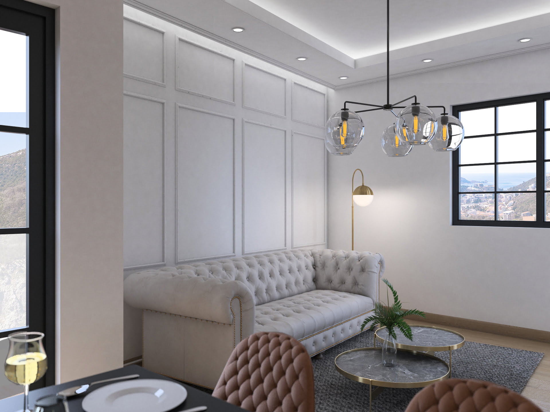 Bright living room with a Chesterfield sofa in the Bečići residential complex, Budva Riviera, Montenegro: sea and mountain view from the window.