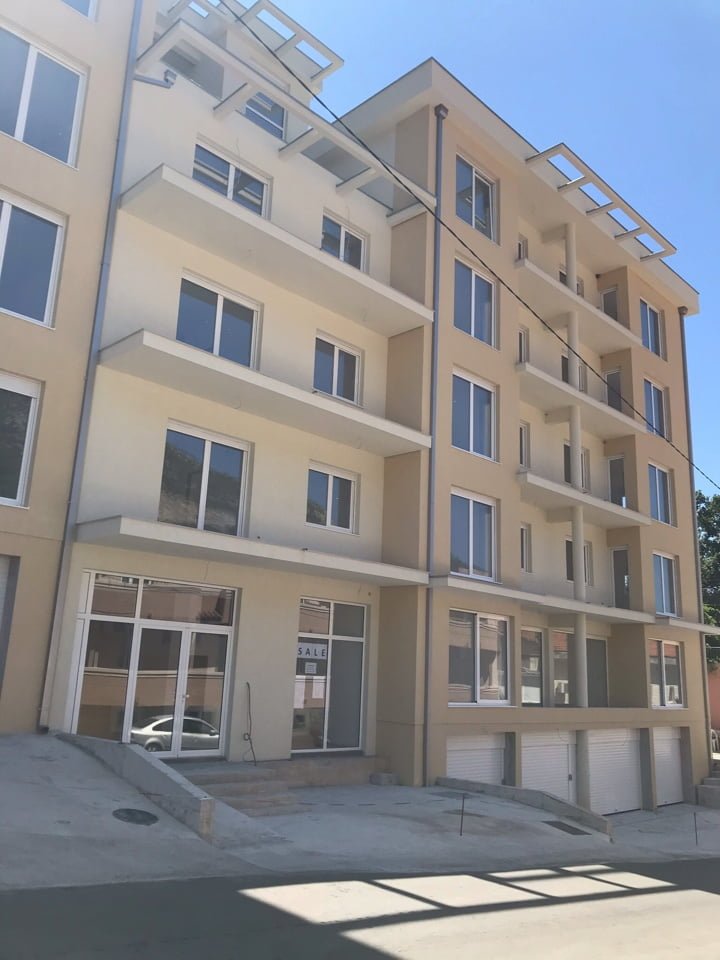 Modern residential complex with balconies and garages for sale in Bečići, Montenegro.