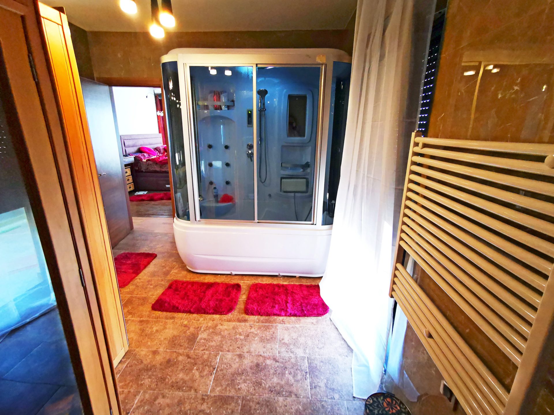 Bathroom with a shower cabin and tiled finishes in a villa in Bar, Montenegro.