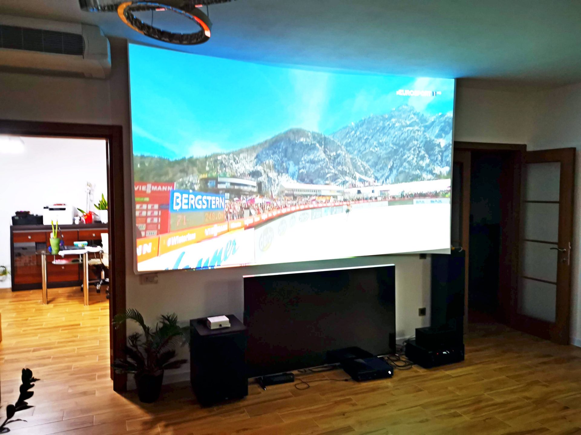Living room with a large projection screen and home theater in a villa in the city of Bar, Montenegro.