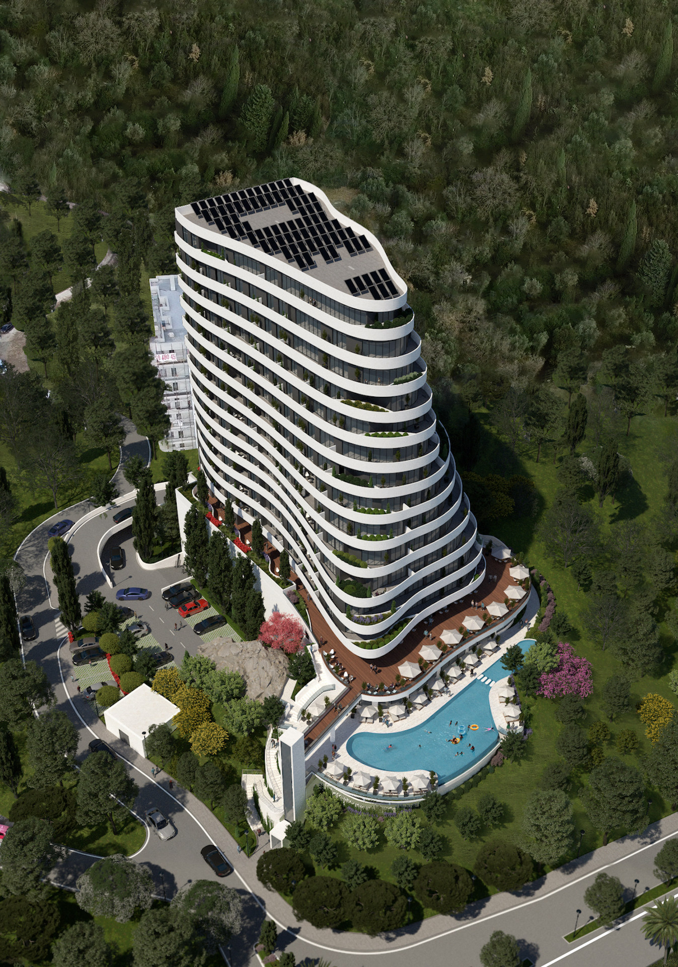 Modern residential complex with a swimming pool and solar panels in Rafailovići, Montenegro: aerial view of the building.