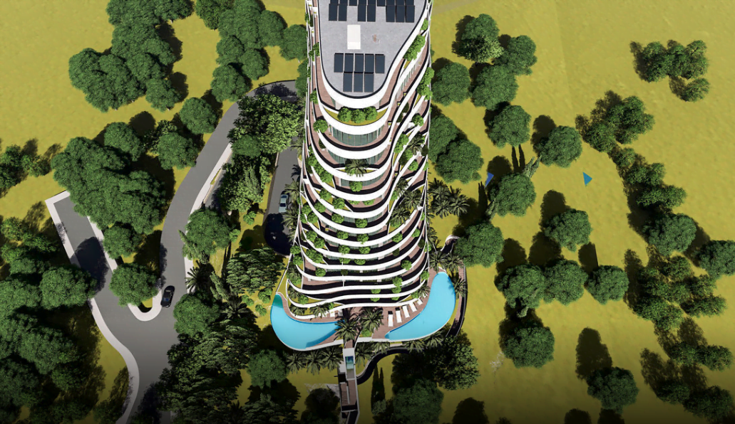 Top view of a modern residential complex in Rafailovići, Montenegro: terraces with greenery and an outdoor pool.