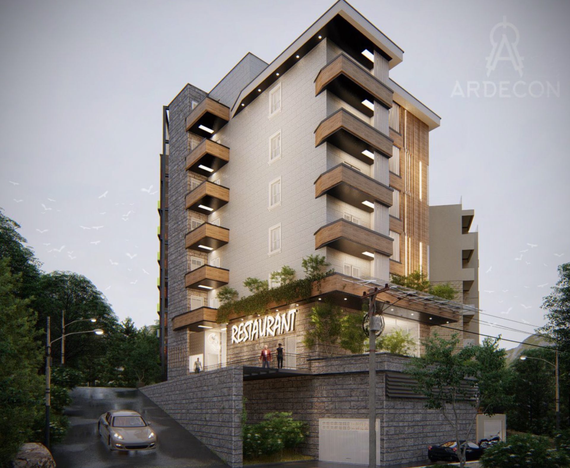 Modern residential building with a restaurant in Bečići, Montenegro: facade with balconies, stone cladding, and parking.