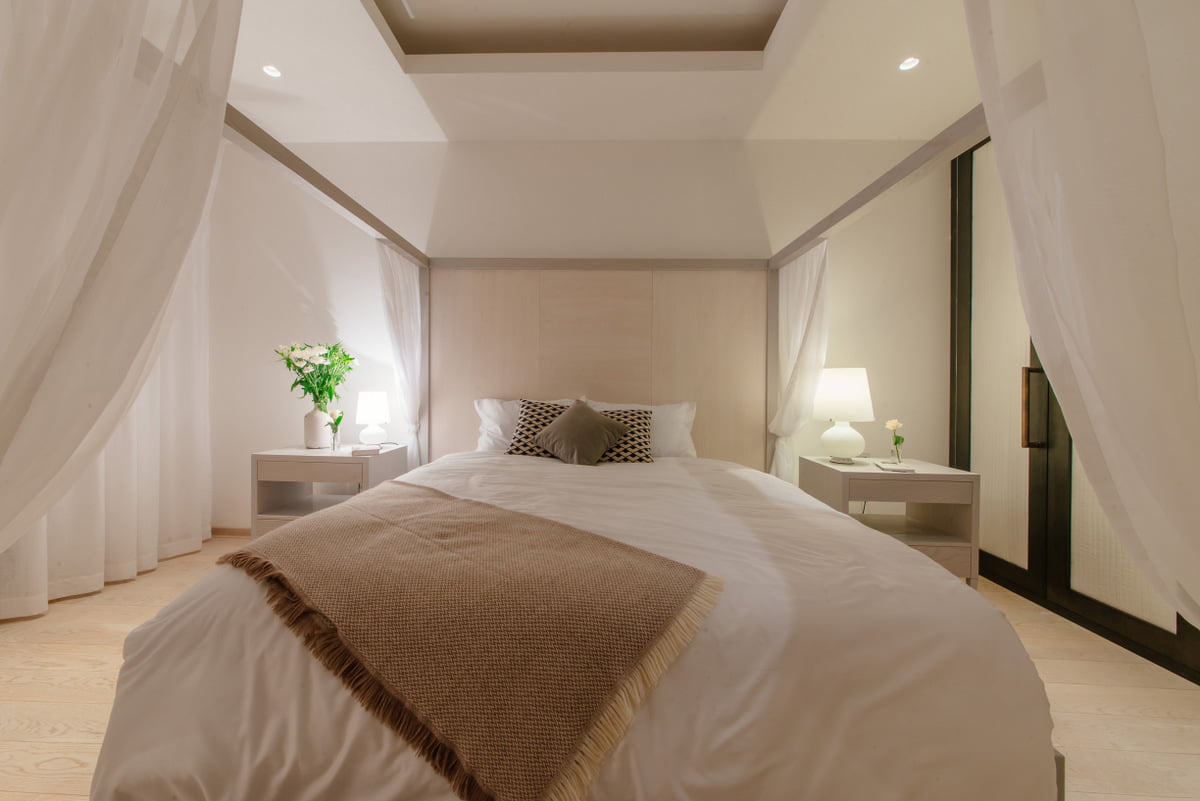 Cozy bedroom with a canopy bed in a modern apartment, Kumbor, Montenegro: stylish interior and decor.