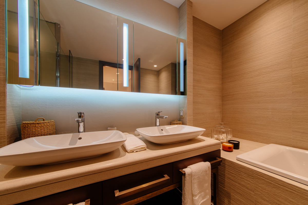 Modern bathroom with two sinks in a luxury apartment, Kumbor, Montenegro: stylish finishes and lighting.