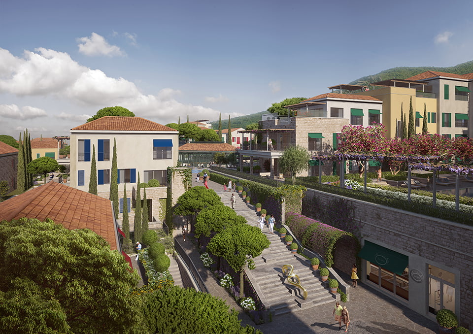 View of the luxury Porto Novi residential complex in Kumbor, Montenegro: stone villas, landscaping, and walking areas.