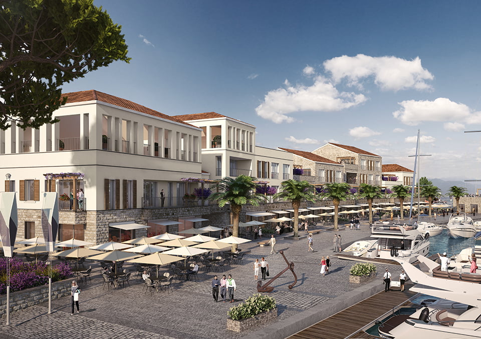 View of the luxury Porto Novi complex in Kumbor, Montenegro: promenade, yacht marina, restaurants, and residential buildings.