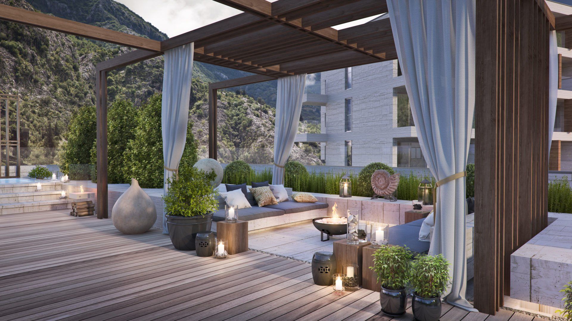 Terrace with a pergola, soft seating, and a fire pit area in a luxury residential complex in Kotor, Montenegro.